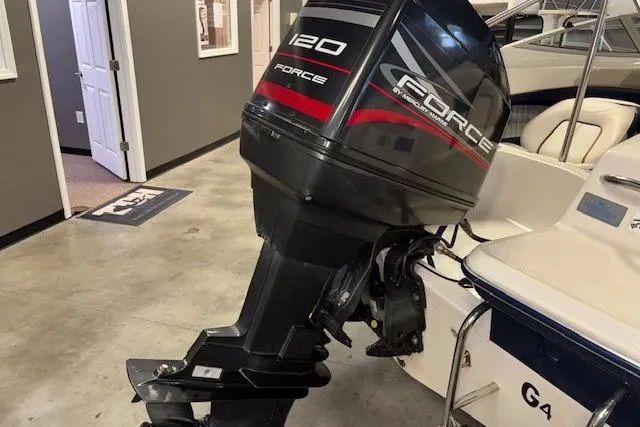 Slide: The Image of 1996 Bayliner 1700 LS boat with Force 120 outboard motor in showroom. - 9