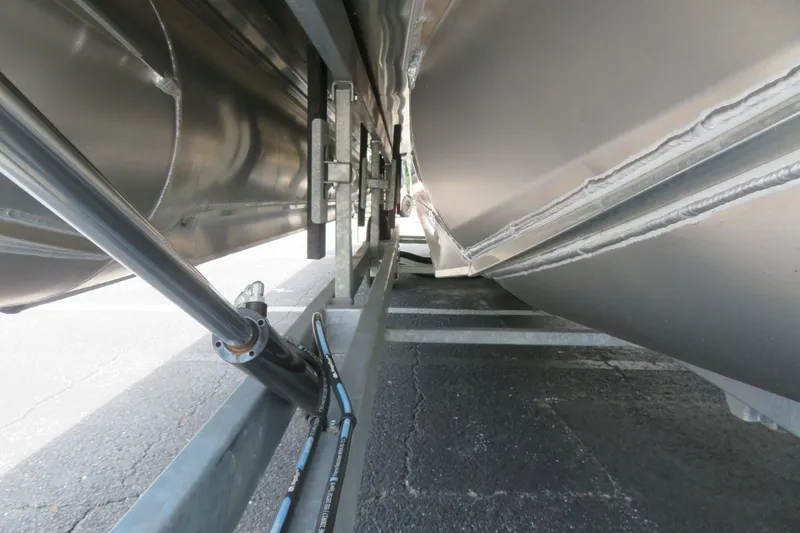 Slide: The Image of Close-up of 2026 Avalon 2385 Venture 85 Tri-toon undercarriage, showcasing structural details. - 45