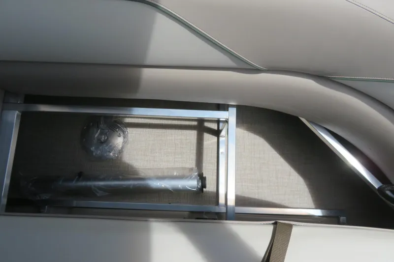 Slide: The Image of Storage compartment in 2026 Avalon 2385 Venture 85 Rear Fish luxury tri-toon boat. - 49