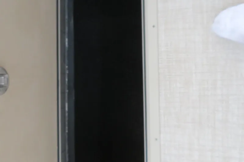 Slide: The Image of Close-up of a door with a handle, part of Avalon 2385 Venture 85 Tri-toon. - 57