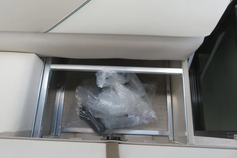 Slide: The Image of Storage compartment in Avalon 2385 Venture 85 Rear Fish luxury tri-toon, Sarasota, FL, 2026 model. - 59