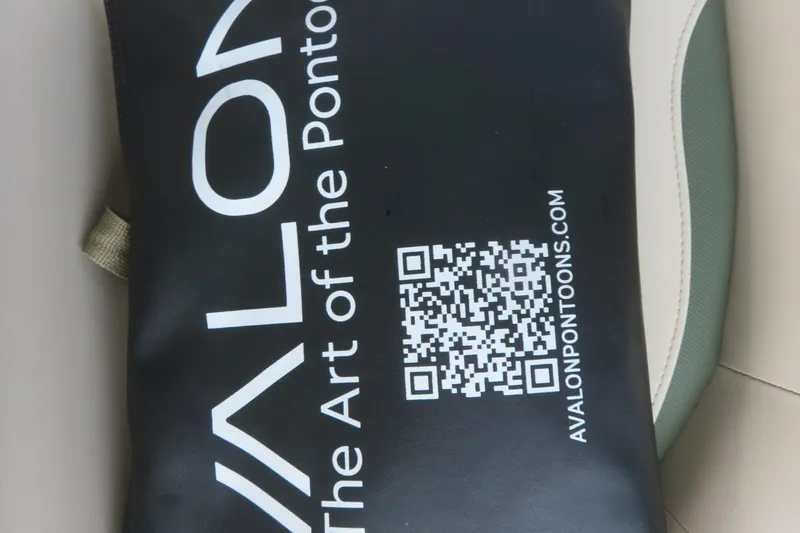 Slide: The Image of QR code on Avalon pontoon seat, showcasing "The Art of the Pontoon" branding. - 77