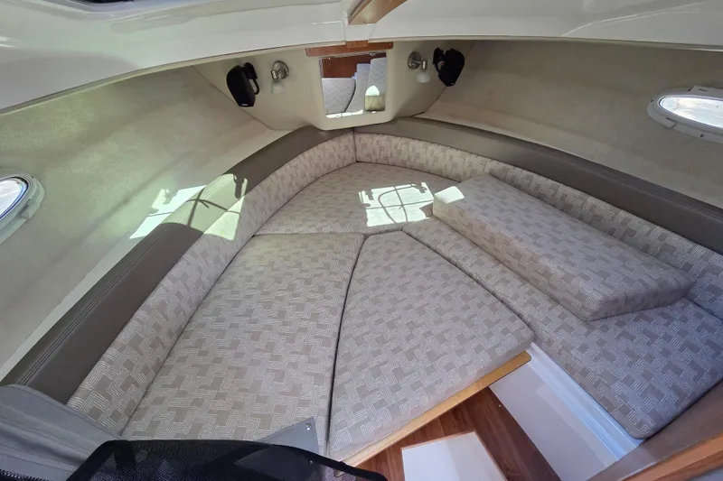 Slide: The Image of 2026 Cutwater C-248 Coupe interior cabin with cushioned seating and natural light. - 14