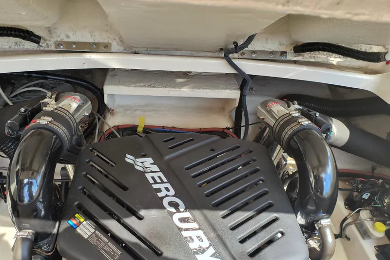 Slide: The Image of Engine compartment of a 2005 Sea Ray 270 SLX with Mercury engine components. - 16