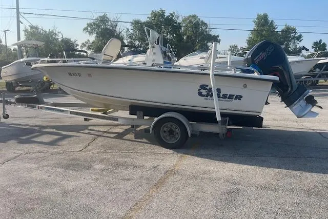 Slide: The Image of 2005 Carolina Skiff Sea Chaser 1800 boat on trailer, parked outdoors. - 4