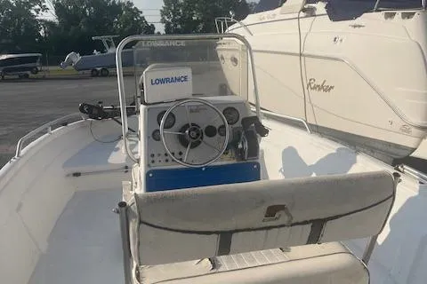 Slide: The Image of 2005 Carolina Skiff Sea Chaser 1800 boat interior with steering console and Lowrance equipment. - 8