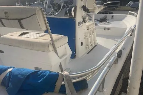 Slide: The Image of 2005 Carolina Skiff Sea Chaser 1800 boat interior with seating and steering console. - 9