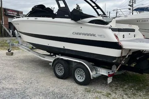 The Image of 2023 Chaparral 247 SSX boat on trailer, parked outdoors. - 0