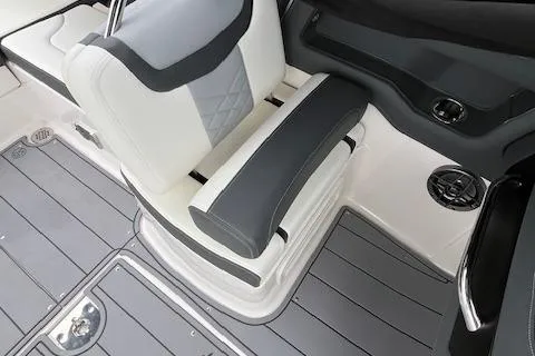 Slide: The Image of 2023 Chaparral 247 SSX boat interior with gray and white seating and flooring. - 12