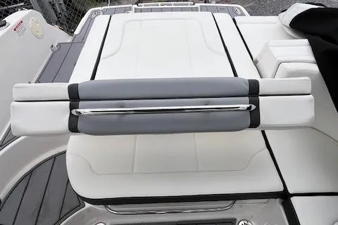Slide: The Image of 2023 Chaparral 247 SSX boat seating with sleek white and gray upholstery. - 17