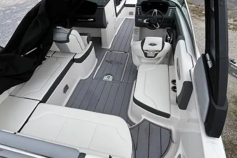 Slide: The Image of 2023 Chaparral 247 SSX boat interior with sleek seating and modern dashboard design. - 5