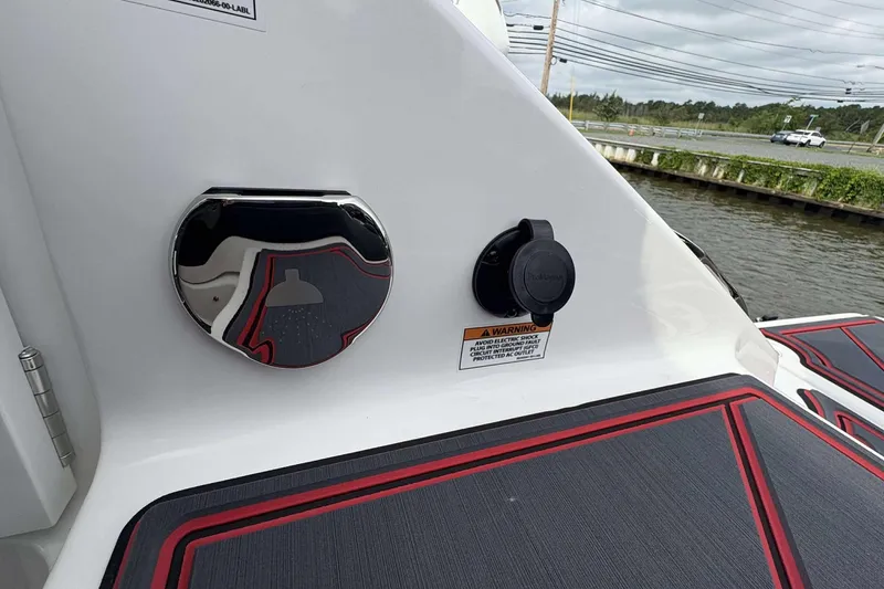 Slide: The Image of 2026 Monterey Elite 30 OB boat with shower and power outlet on deck. - 11