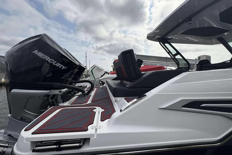 Slide: The Image of 2026 Monterey Elite 30 OB boat with Mercury engine, sleek design, and modern seating. - 12