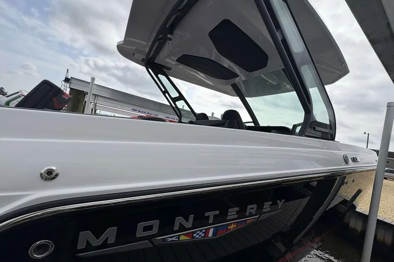 Slide: The Image of 2026 Monterey Elite 30 OB boat docked, showcasing sleek design and modern features. - 14