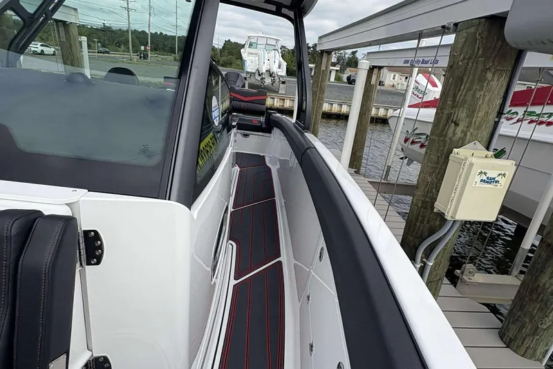 Slide: The Image of 2026 Monterey Elite 30 OB boat docked, showcasing sleek design and modern features. - 16