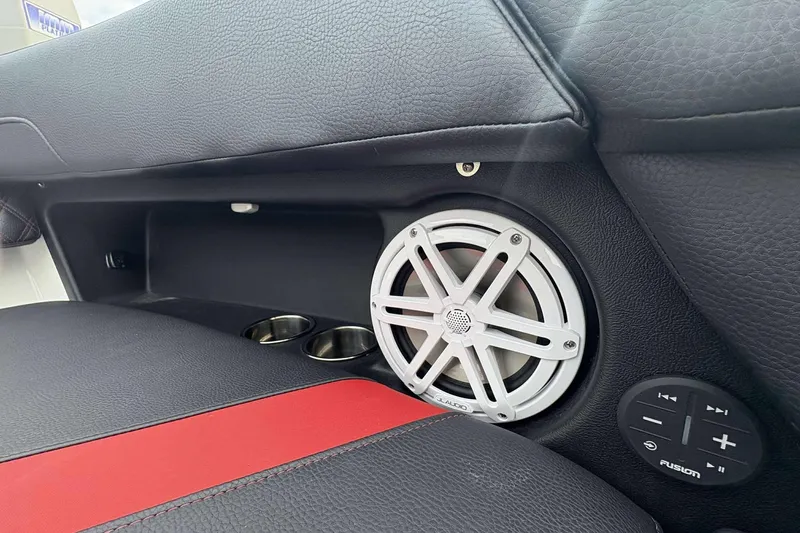 Slide: The Image of 2026 Monterey Elite 30 OB interior with speaker, cup holders, and control panel. - 18