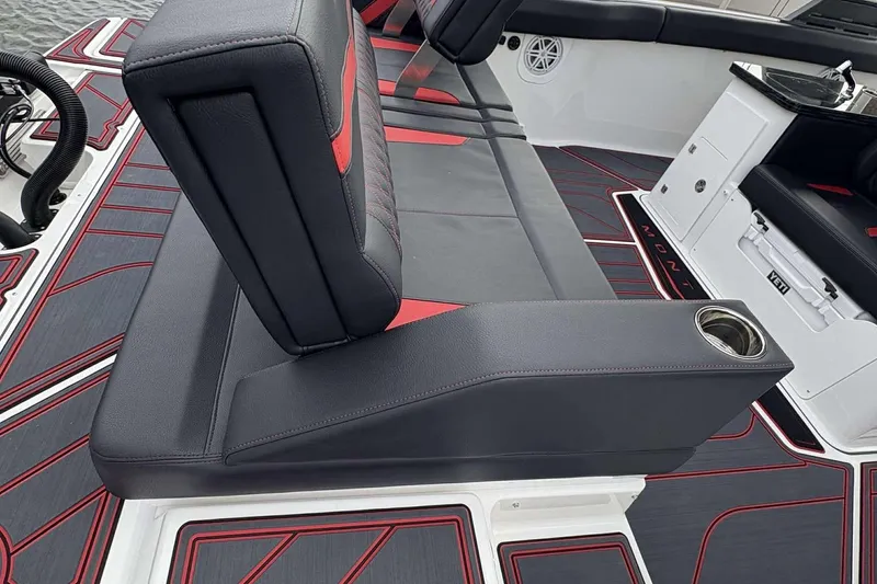 Slide: The Image of Luxurious seating on 2026 Monterey Elite 30 OB boat with stylish red and black design. - 22
