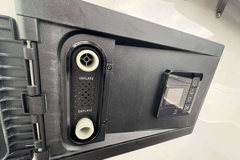 Slide: The Image of Inflate and deflate controls on 2026 Monterey Elite 30 OB boat. - 23