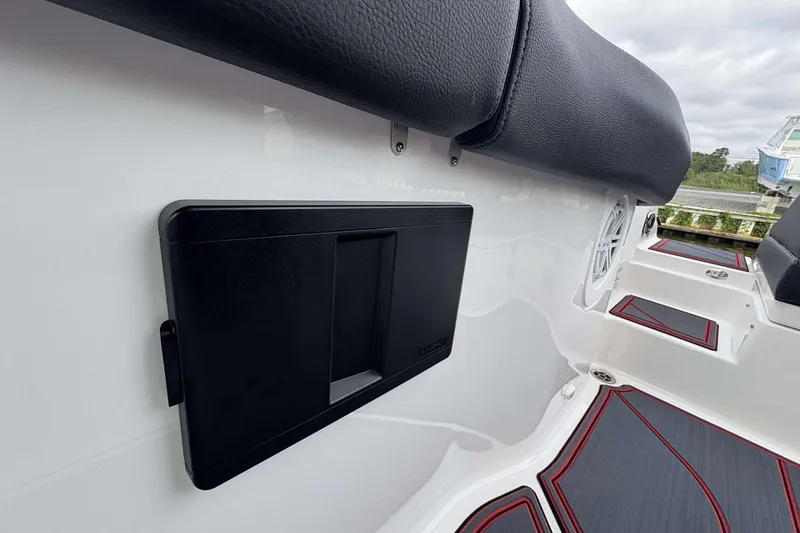 Slide: The Image of 2026 Monterey Elite 30 OB boat interior with black seating and sleek design. - 24