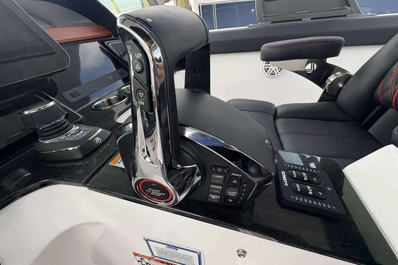 Slide: The Image of Control panel of 2026 Monterey Elite 30 OB boat with advanced navigation features. - 28