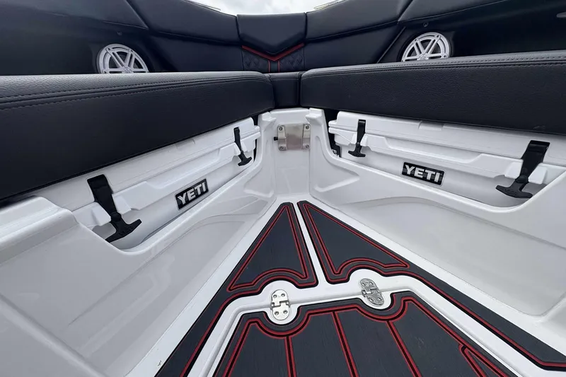 Slide: The Image of Interior of 2026 Monterey Elite 30 OB boat with Yeti coolers and stylish seating. - 32