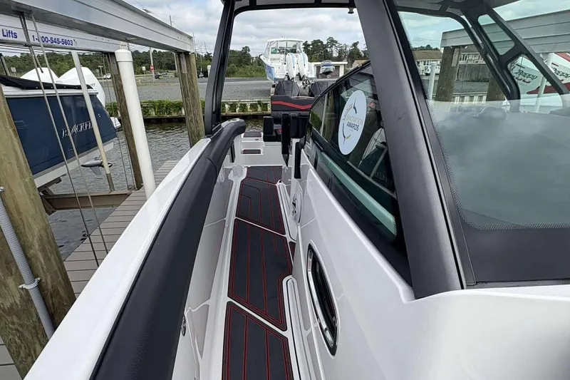 Slide: The Image of 2026 Monterey Elite 30 OB boat docked, showcasing sleek design and modern features. - 36