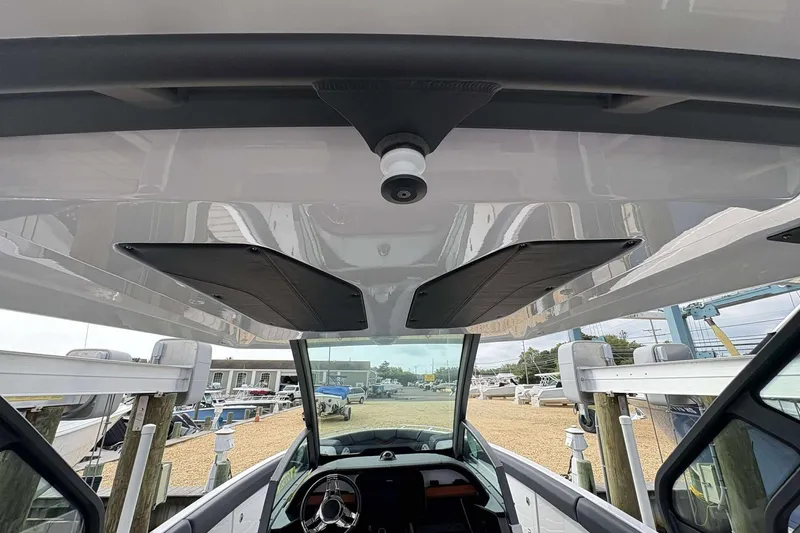 Slide: The Image of 2026 Monterey Elite 30 OB boat interior view with sleek design and modern controls. - 8