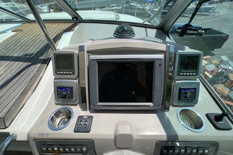 Slide: The Image of Cockpit dashboard of 2011 Chaparral 330 Signature boat with navigation and control systems. - 13