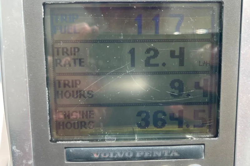 Slide: The Image of Volvo Penta display showing trip fuel, rate, hours, and engine hours for 2011 Chaparral 330 Signature. - 14
