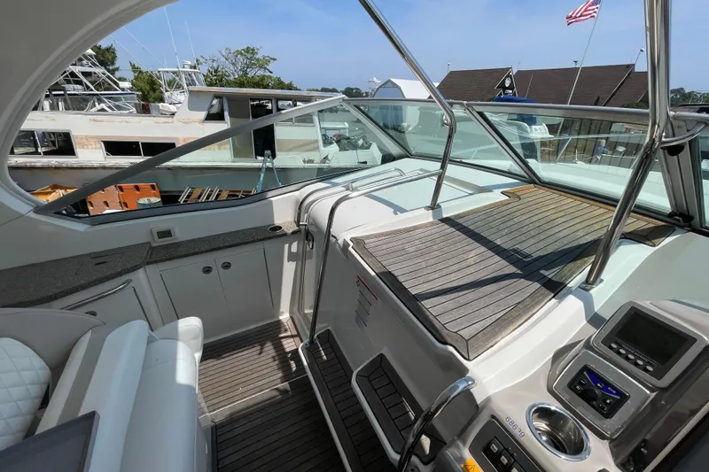 Slide: The Image of 2011 Chaparral 330 Signature boat interior with sleek design and modern controls. - 20