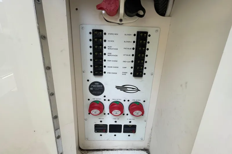 Slide: The Image of Electrical panel of a 2011 Chaparral 330 Signature boat with switches and battery controls. - 40