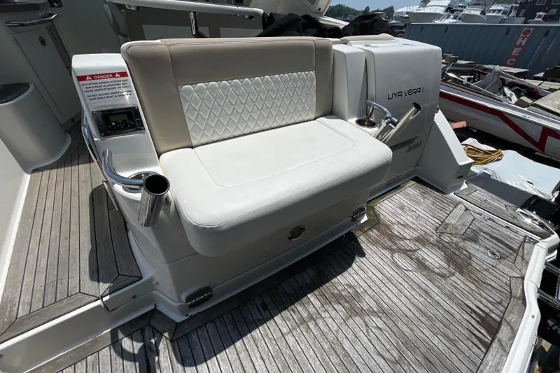 Slide: The Image of 2011 Chaparral 330 Signature boat with white seating and wooden deck. - 43