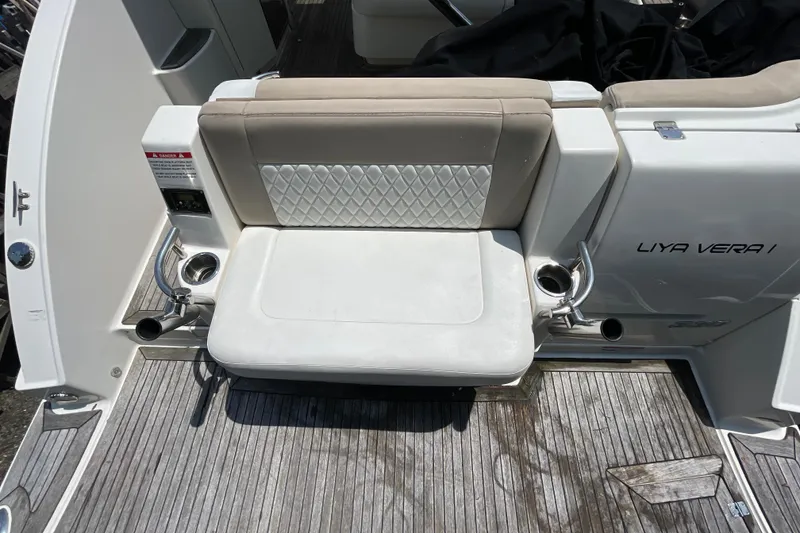 Slide: The Image of 2011 Chaparral 330 Signature boat seating area with cup holders on deck. - 44