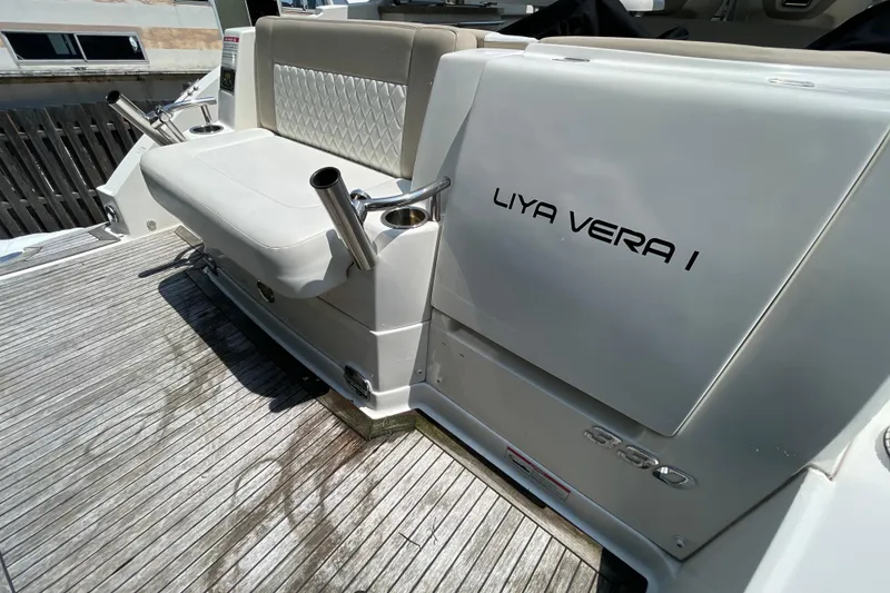Slide: The Image of 2011 Chaparral 330 Signature boat deck with seating and rod holders. - 45