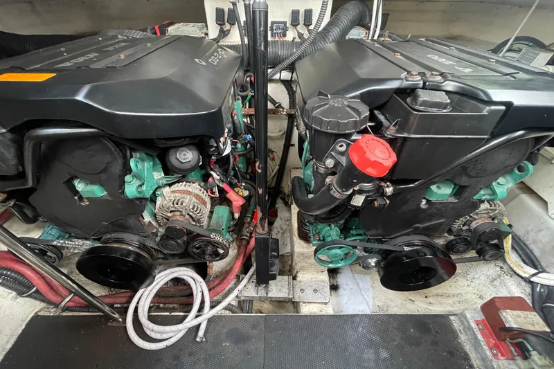 Slide: The Image of Engine compartment of a 2011 Chaparral 330 Signature boat, featuring dual Volvo Penta engines. - 48