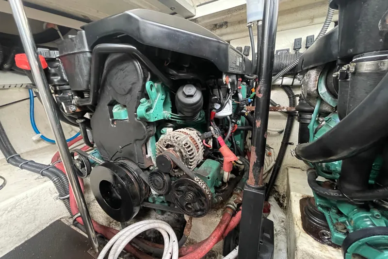 Slide: The Image of Engine compartment of a 2011 Chaparral 330 Signature boat, showcasing mechanical components. - 50