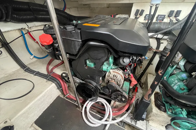 Slide: The Image of Engine compartment of a 2011 Chaparral 330 Signature boat, showcasing mechanical components. - 52