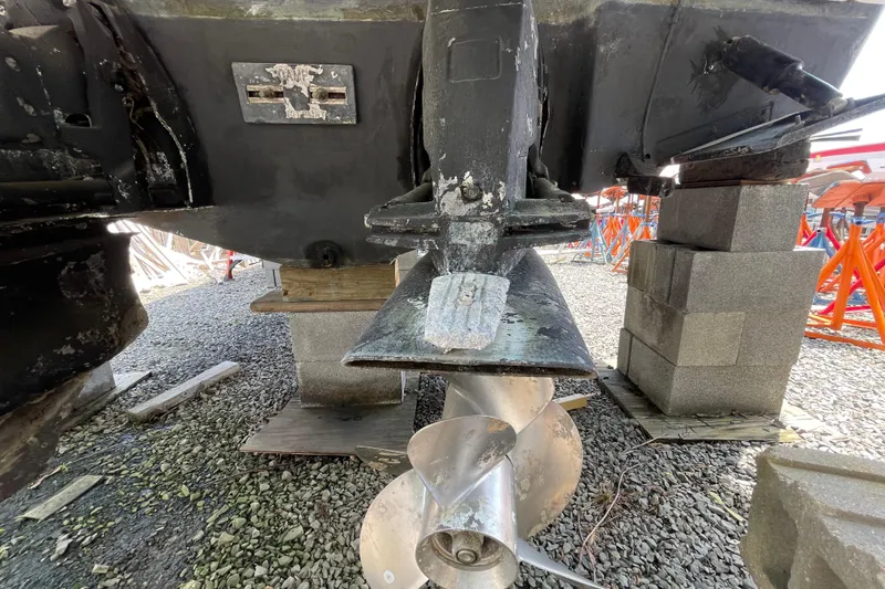 Slide: The Image of 2011 Chaparral 330 Signature boat propeller and stern drive on blocks. - 59