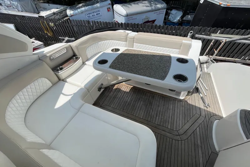 Slide: The Image of Luxurious 2011 Chaparral 330 Signature boat interior with elegant seating and table. - 7