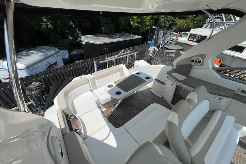 Slide: The Image of Luxurious 2011 Chaparral 330 Signature yacht interior with seating and table. - 8