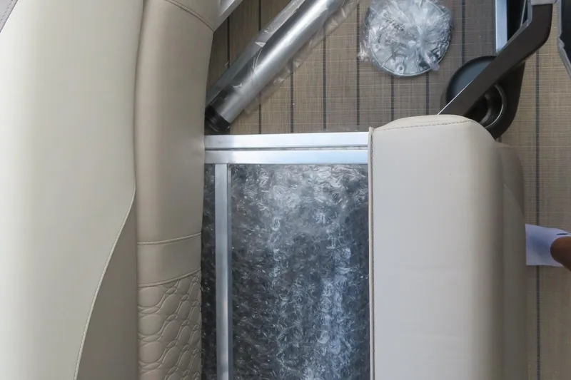 Slide: The Image of 2026 Avalon 2385 LSZ Quad Lounger interior detail with luxury seating and packaging materials. - 42