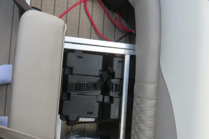 Slide: The Image of Avalon 2385 LSZ Quad Lounger 2026 interior detail with battery compartment, Sarasota, FL. - 43