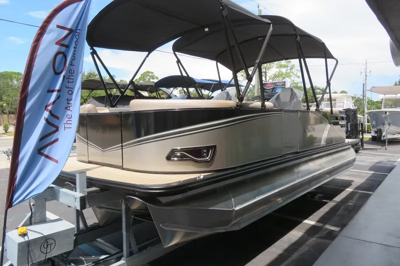 Slide: The Image of 2026 Avalon 2385 LSZ Quad Lounger luxury tri-toon boat displayed in Sarasota, FL. - 2