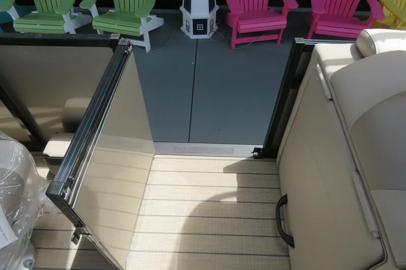 Slide: The Image of 2026 Avalon 2385 LSZ Quad Lounger interior with beige seating and open gate, Sarasota, FL. - 24