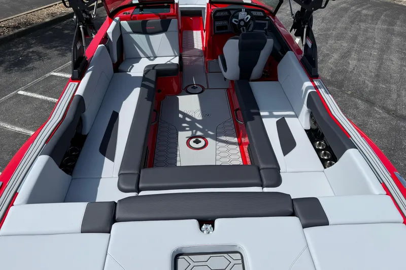 Slide: The Image of 2025 MasterCraft NXT24 boat interior with sleek seating and modern design. - 10