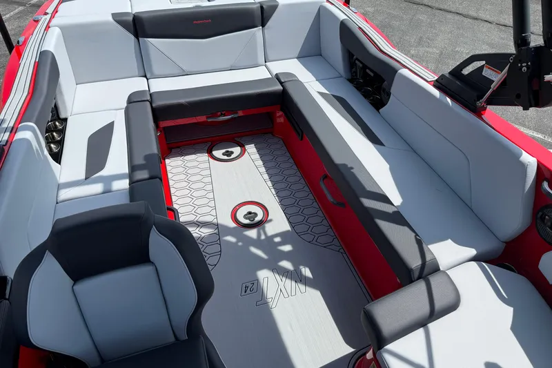 Slide: The Image of 2025 MasterCraft NXT24 boat interior with modern seating and stylish design. - 14