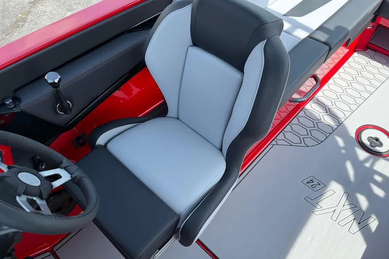 Slide: The Image of 2025 MasterCraft NXT24 boat interior with sleek seating and modern design. - 18