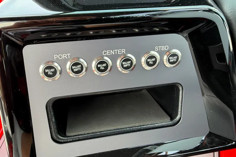 Slide: The Image of Ballast control panel of 2025 MasterCraft NXT24 boat, featuring fill and empty buttons. - 20