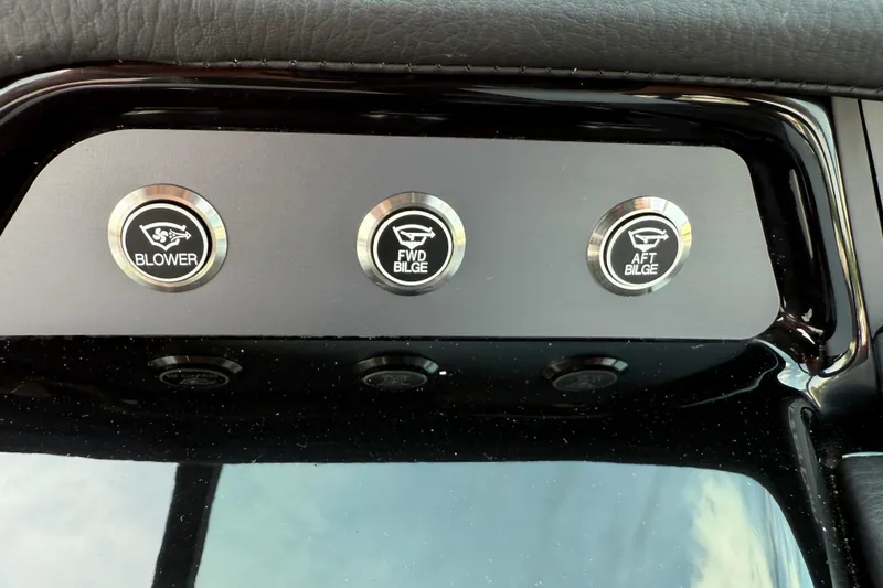 Slide: The Image of Control panel of 2025 MasterCraft NXT24 boat with blower and bilge buttons. - 21