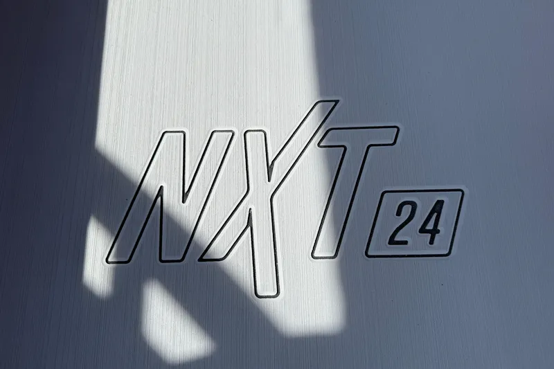 Slide: The Image of MasterCraft NXT24 2025 logo on a sleek metallic surface. - 37